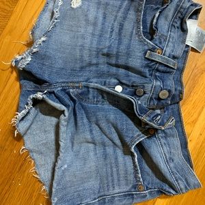 Slightly ripped Levi’s Jean shorts